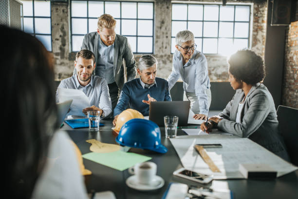 istock Team of architects working on business plans in the office. 1156392056