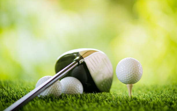 istock golf ball on tee with club to tee off 1156393120