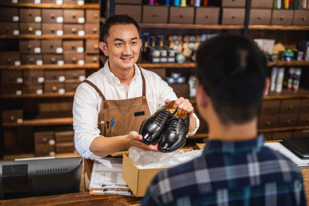 istock Luxury Shoe Store Transaction in Taipei 1156393560