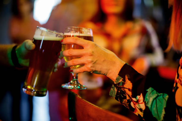istock Female friends drinking beer 1156394994