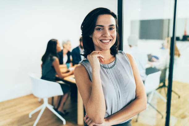 istock Business woman with his team behind 1156397247