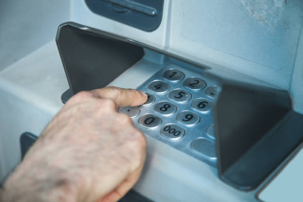 istock Man hand pressing on ATM machine keypad. ATM. Withdraw money 1156397773