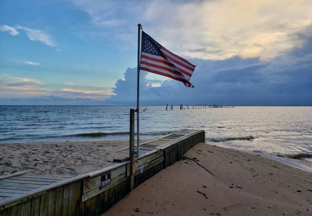 istock American flag at sunset 1156398625