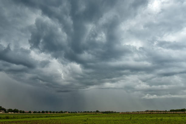 istock threatening storm clouds over farmland 1156400092