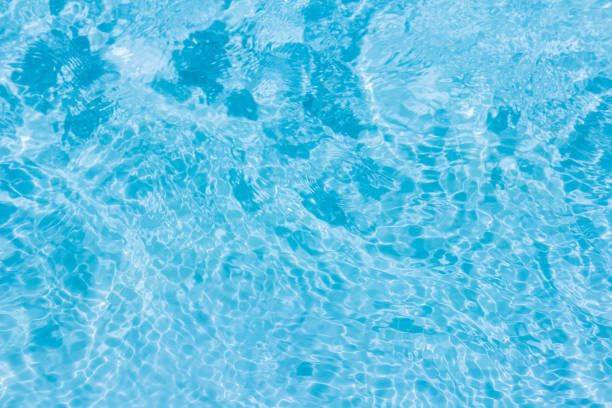 istock swimming pool with sunny reflections 1156402975