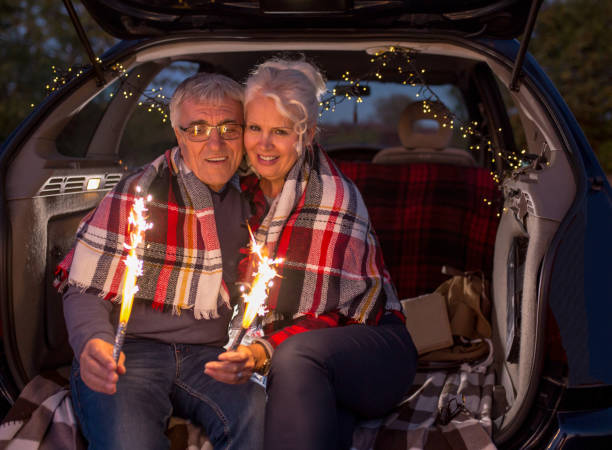 istock Senior couple outdoors with car 1156404618