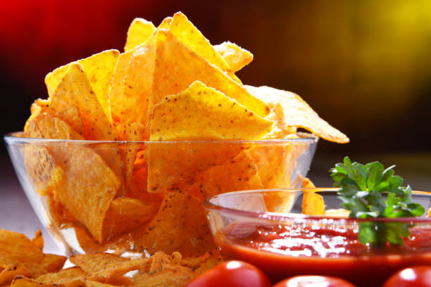 istock Composition with bowl of potato chips. 1156404868