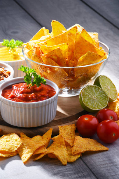 istock Composition with bowl of potato chips. 1156404992