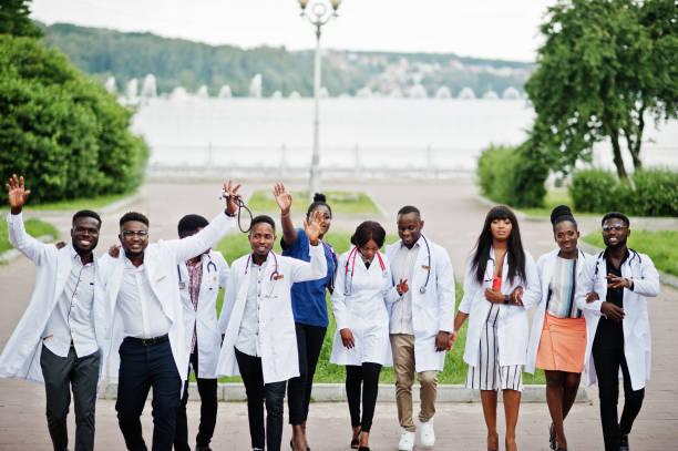 istock Group of african medical students posed in lab coats 1156405657