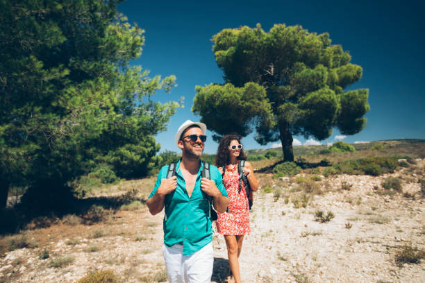 Couple backpackers hiking in nature, Greece.