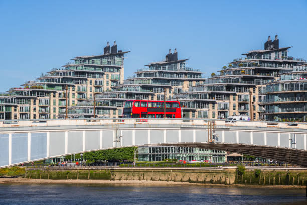 Wandsworth bridge with riverside apartments in the background in London Wandsworth bridge with riverside apartment in the background in London, UK wandsworth photos stock pictures, royalty-free photos & images