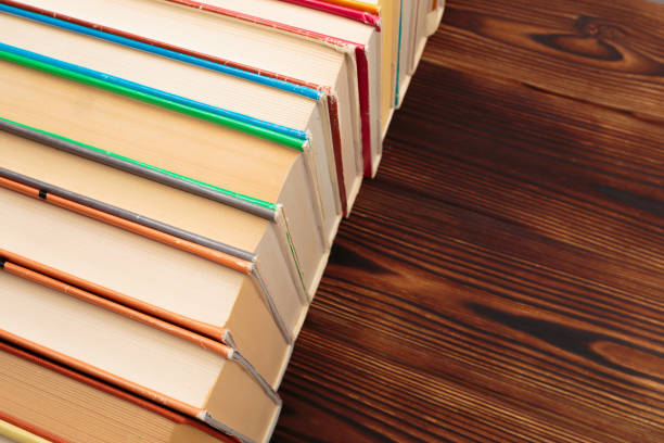 istock Stack of books on a wooden background.Education. - Image 1156414086