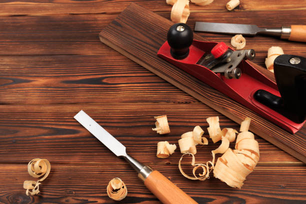 istock chisels plane and sawdust on a wooden table - Image 1156414418