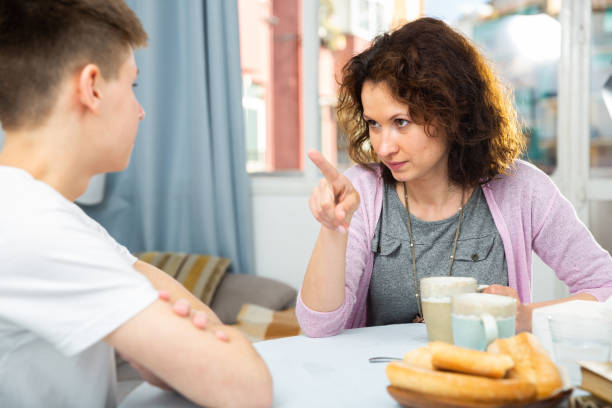istock Worried mother talking to son 1156417901