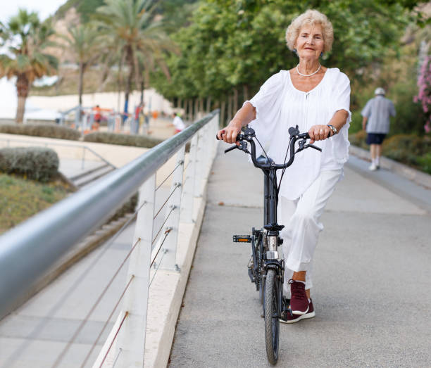 istock Elderly woman going to biking 1156417978