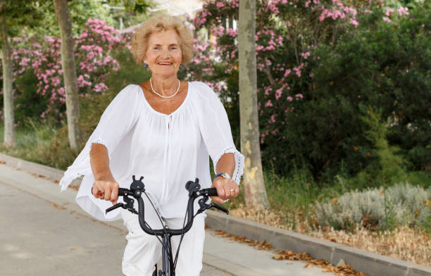istock Mature woman cycling 1156418014
