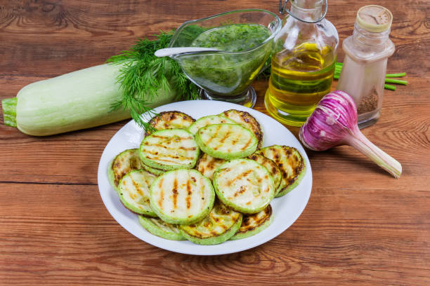 istock Grilled chopped by circles vegetable marrows with ingredients and seasonings 1156418171