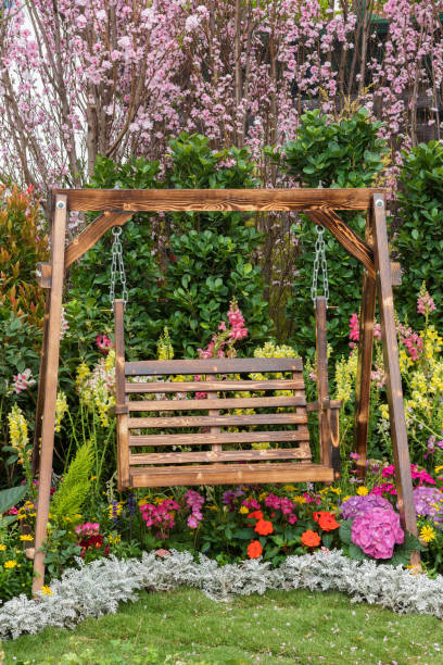 istock swing seat in garden 1156418332