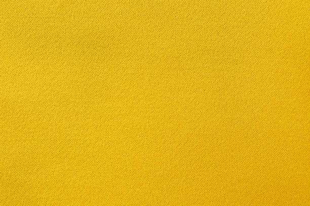 Yellow fabric texture background, seamless pattern of natural textile surface.