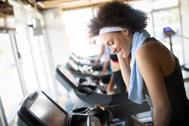 istock Group of young people training in gym 1156424058