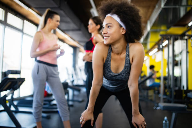 istock Healthy young athletes doing exercises at fitness studio. 1156424233