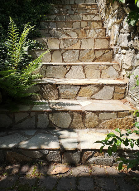 istock stairs with stone tiles leading up in beautiful sunlight 1156425583