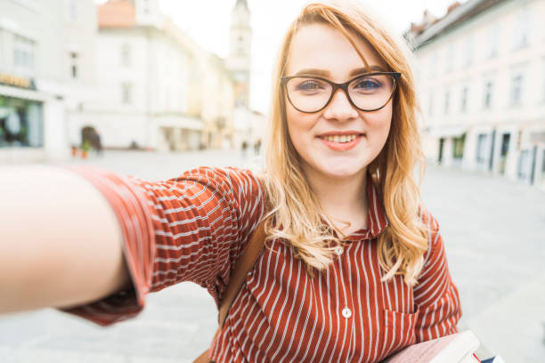 istock Cheerful art student with red hair and eyeglasses 1156425638