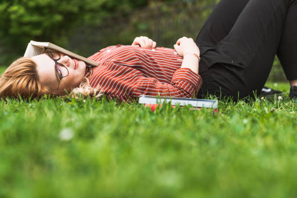 istock Exhausted college student gave up on studying - Taking a break in the park 1156426086