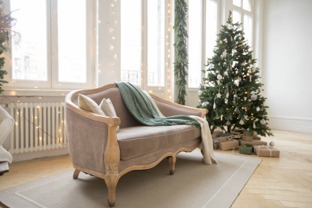 istock Sofa and Christmas tree near windows 1156428712
