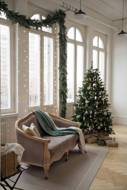 istock Sofa and Christmas tree near windows 1156428852
