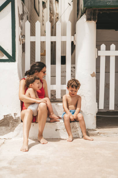 istock Family walking in El Garraf Beach 1156429552
