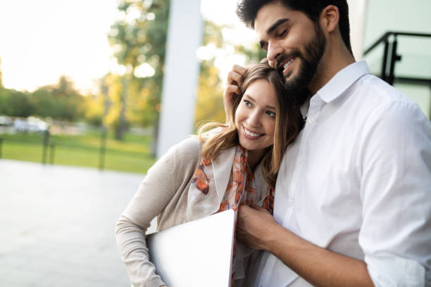 istock Young couple using a digital tablet together and smiling 1156430104