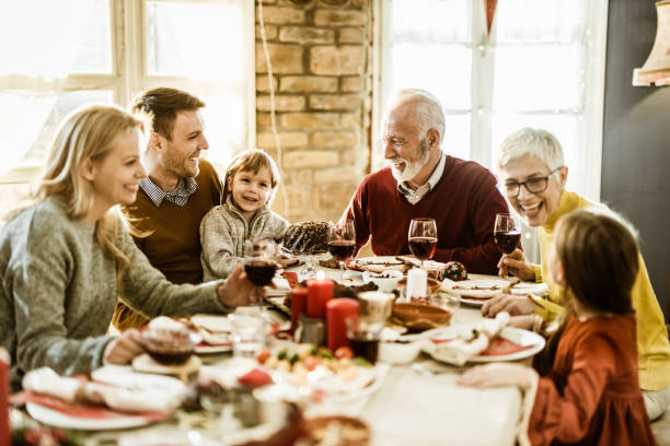 istock Happy multi-generation family talking during a meal at dining table. 1156430182