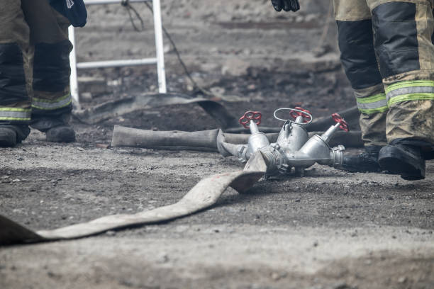 istock Firefighter rescue working from burning building  in fire and smoke  incident. 1156433045