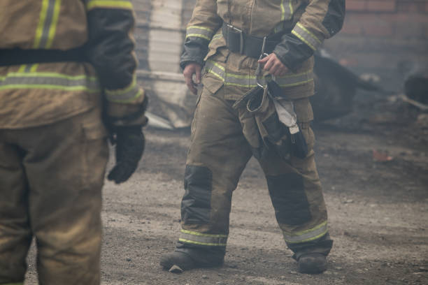 istock Firefighter rescue working from burning building  in fire and smoke  incident. 1156433841