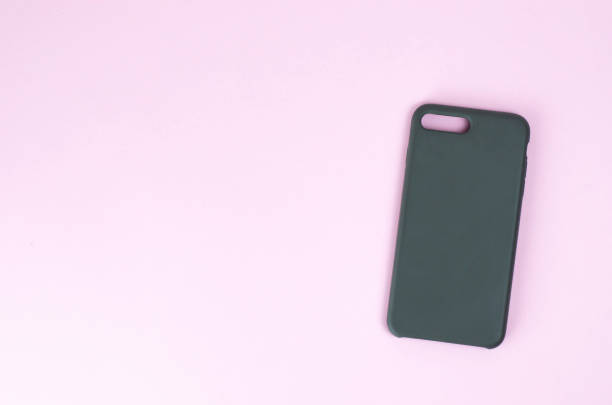 istock Silicone case for smartphone on a paper background. 1156434169