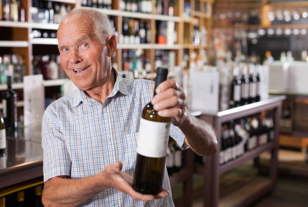 istock Man searchng wine in winehouse 1156434233
