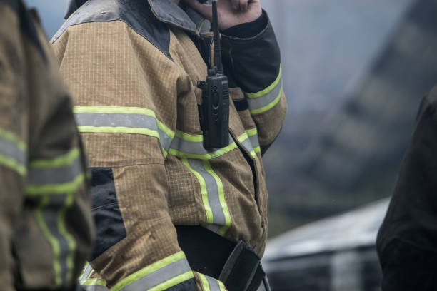istock Firefighter rescue working from burning building  in fire and smoke  incident. 1156434433