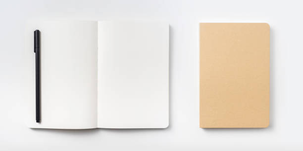 istock Top view of hardcover kraft notebook and pen 1156434816