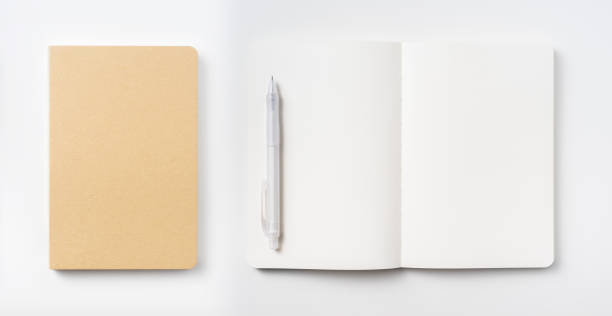 istock Top view of hardcover kraft notebook and pen 1156434847