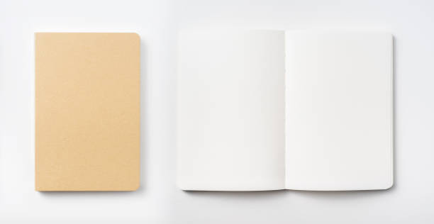 istock Top view of hardcover kraft notebook and pen 1156434884