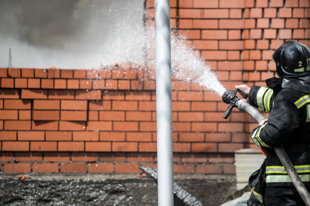istock Firefighters on the stairs extinguish a big fire 1156435190