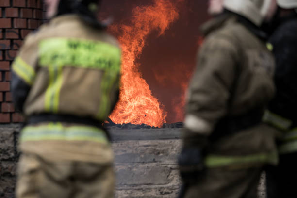 istock Firefighter rescue working from burning building  in fire and smoke  incident. 1156435486