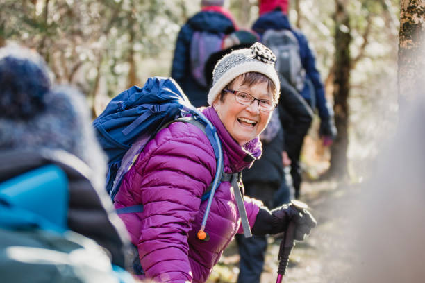 Countryside Wanderlust Member of a female club hiking for a body positivity campaign. The group are wearing back packs and waterproof clothing. english spoken stock pictures, royalty-free photos & images