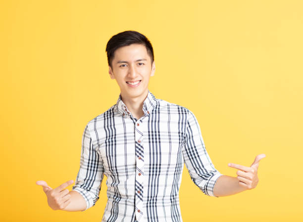 istock close up handsome young man smiling 1156440059