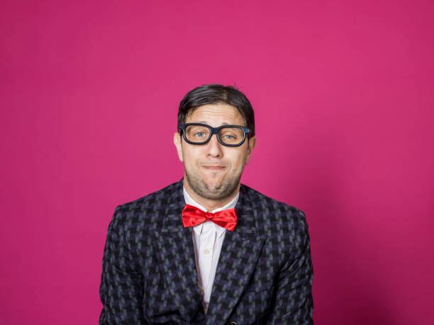 istock Nerd male portrait on pink 1156444802
