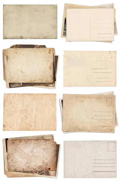 Photo of Set of various Old papers and postcards with scratches and stains texture isolated