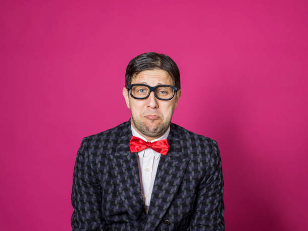 istock Nerd male portrait on pink 1156447086