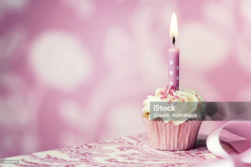 Birthday cupcake Cupcake decorated with a single candle Birthday Stock Photo