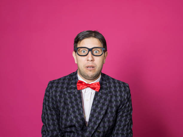 istock Nerd male portrait on pink 1156449254